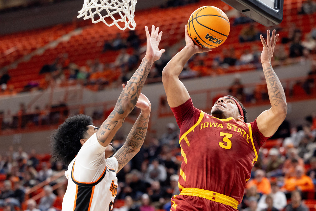 Iowa State guard Tamin Lipsey (3) shoots over Oklahoma State guard Vyctorius Miller (5) in the first half of the NCAA college basketball game, Saturday, Jan. 24, 2026 in Stillwater, Okla. (AP Photo/Mitch Alcala)