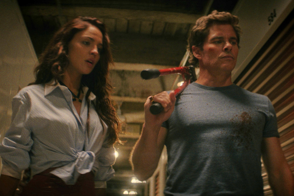 This image released by 20th Century Studios shows Eiza González and James Marsden, right, in a scene from "Mike & Nick & Nick & Alice." (20th Century Studios via AP)