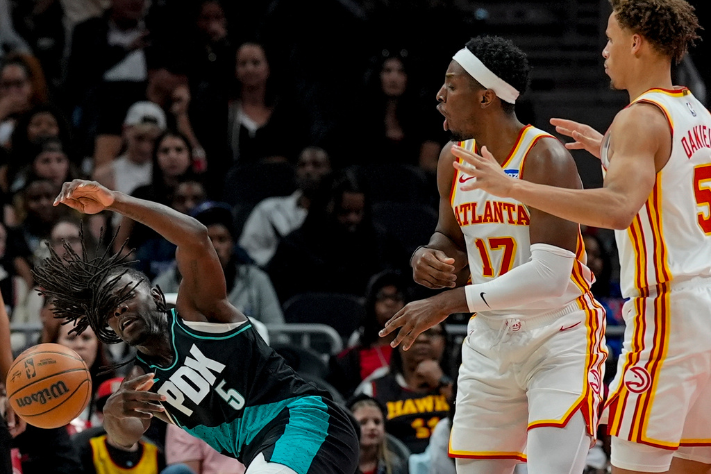 Portland Trail Blazers guard Jrue Holiday (5) moves the ball against the Atlanta Hawks during the first half of an NBA basketball game, Sunday, March 1, 2026, in Atlanta. (AP Photo/Mike Stewart)