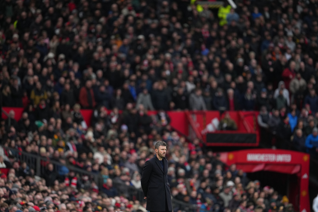 Manchester United's coach Michael Carrick watches the play during the English Premier League soccer match between Manchester United and Tottenham in Manchester, England, Saturday, Feb. 7, 2026. (AP Photo/Jon Super)