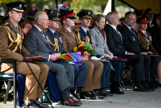 Britain's King Charles, second from left, attends the LGBT+ Armed Forces Dedication Ceremony at the National Memorial Arboretum in Alrewas, England, Monday Oct. 27, 2025. (Phil Noble/Pool via AP) Britain's King Charles, second from left, attends the LGBT+ Armed Forces Dedication Ceremony at the National Memorial Arboretum in Alrewas, England, Monday Oct. 27, 2025. (Phil Noble/Pool via AP)