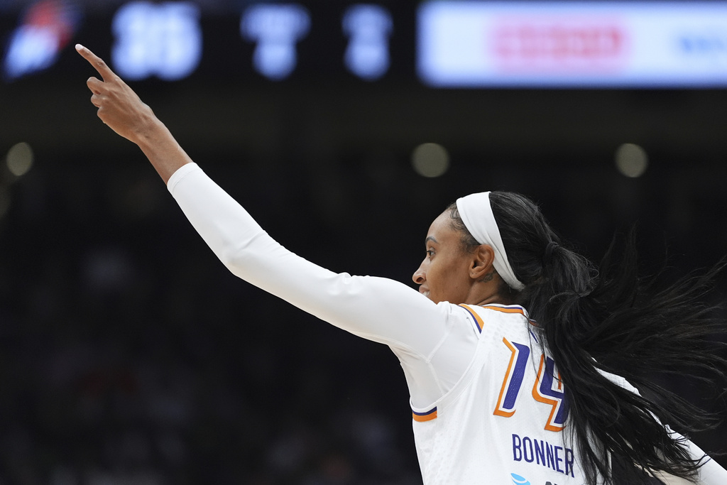 Phoenix Mercury forward DeWanna Bonner reacts after making a basket against the Seattle Storm during the first half of a WNBA basketball game Sunday, Aug. 17, 2025, in Seattle. (AP Photo/Lindsey Wasson)