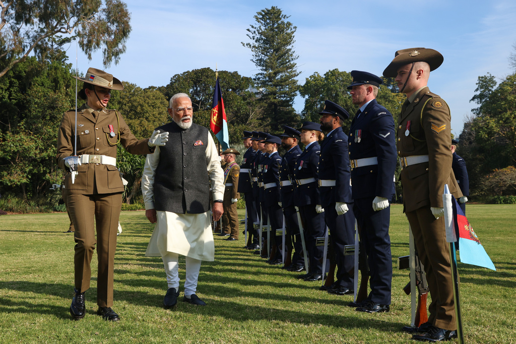 Indian Prime Minister Narendra Modi inspects a guard of honour during a ceremonial welcome at Government House in Melbourne, Australia, Thursday, July 9, 2026. (AP Photo/Hamish Blair)