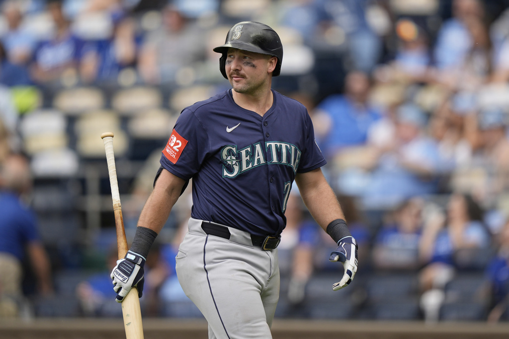 Seattle Mariners' Cal Raleigh walks back to the dugout after striking out during the seventh inning of a baseball game against the Kansas City Royals, Thursday, Sept. 18, 2025, in Kansas City, Mo. (AP Photo/Charlie Riedel)