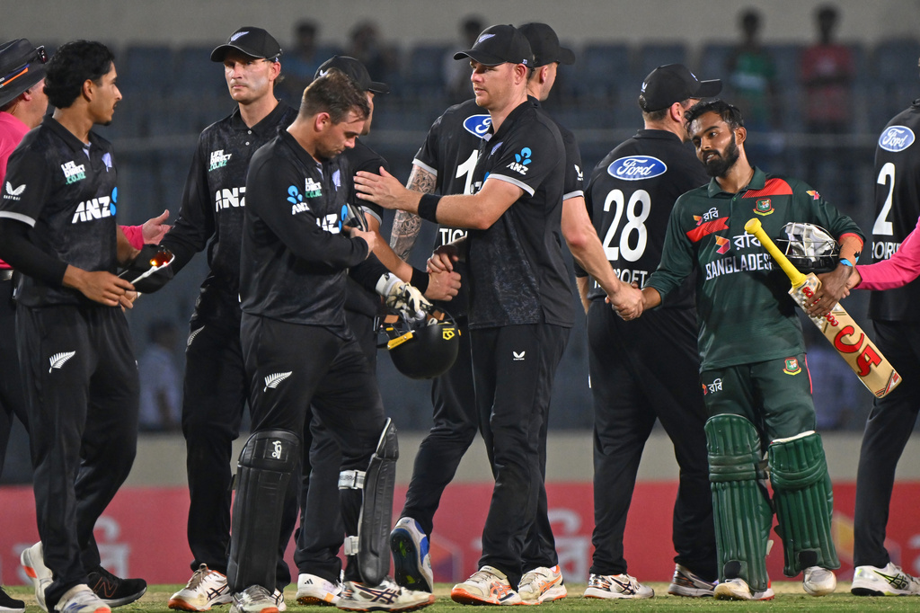 Bangladesh's captain Mehidy Hassan Miraz shake hand with New Zealand players, after winning the second one day international match against New Zealand, in Mirpur, Bangladesh, Monday, April 20, 2026. (AP Photo/Mosaraf Hossain)