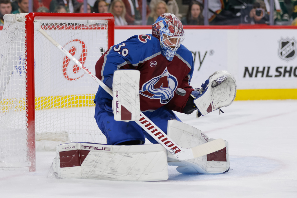 Colorado Avalanche goaltender Mackenzie Blackwood makes a save during the first period of an NHL hockey game against the Minnesota Wild, Sunday, Dec. 21, 2025, in St. Paul, Minn. (AP Photo/Bailey Hillesheim)