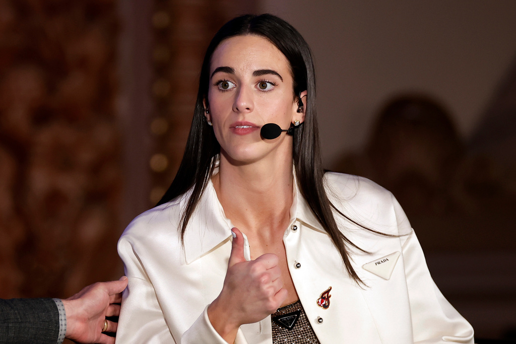 FILE - Indiana Fever's Caitlin Clark reacts during an interview during the WNBA basketball draft, April 15, 2024, in New York. (AP Photo/Adam Hunger, File)