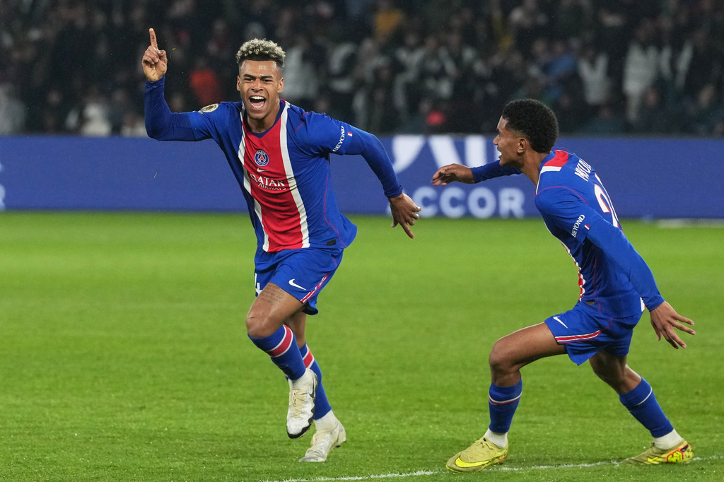 PSG's Desire Doue, left, celebrates scoring his side's opening goal during the French League One soccer match between Paris Saint Germain and Brest in Paris, France, Sunday, May 10, 2026. (AP Photo/Thibault Camus)