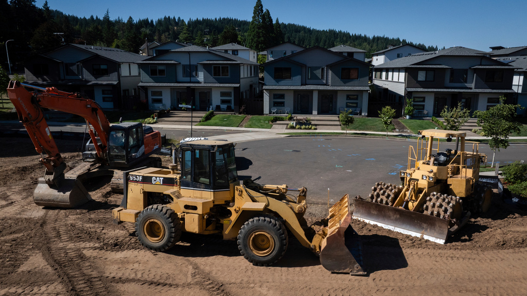FILE - Construction equipment is seen near new homes on July 11, 2025, in Happy Valley, Ore. (AP Photo/Jenny Kane, File)