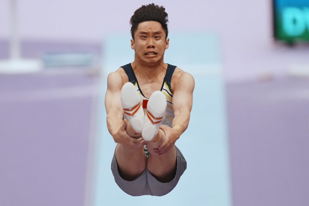 Ng Ka Ki of Hong Kong competes on the vault during the men's artistic gymnastics qualification at the Asian Games in Nagoya, Japan, Monday, Sept. 21, 2026. (AP Photo/Lee Jin-man)
