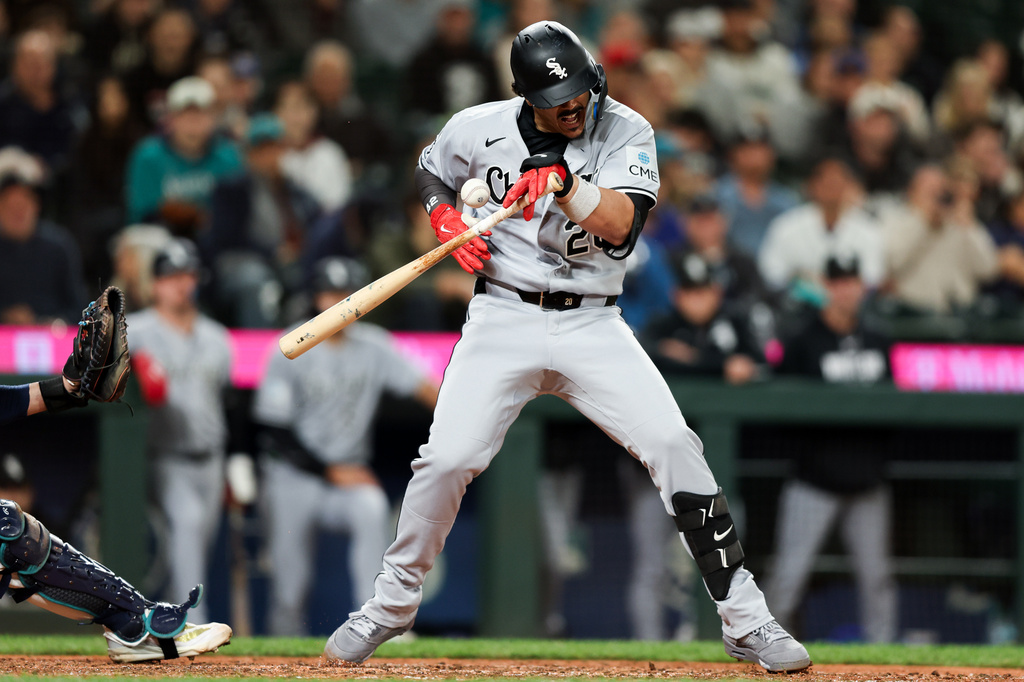 Chicago White Sox's Miguel Vargas is hit by a pitch in the ninth inning of a baseball game against the Seattle Mariners, Tuesday, May 19, 2026, in Seattle. (AP Photo/Kevin Ng)