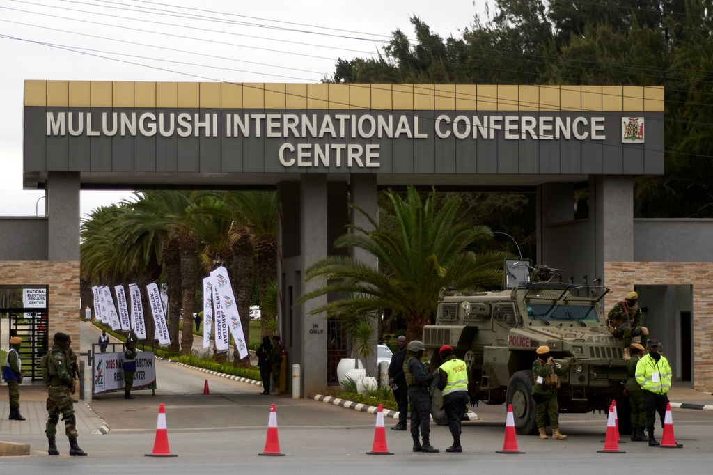 A Zambia's army vehicle is seen parked at the entrance of the Election results centre, in Lusaka, Zambia, Friday, Aug. 14, 2026. (AP Photo/Alfonso Nqunjana)