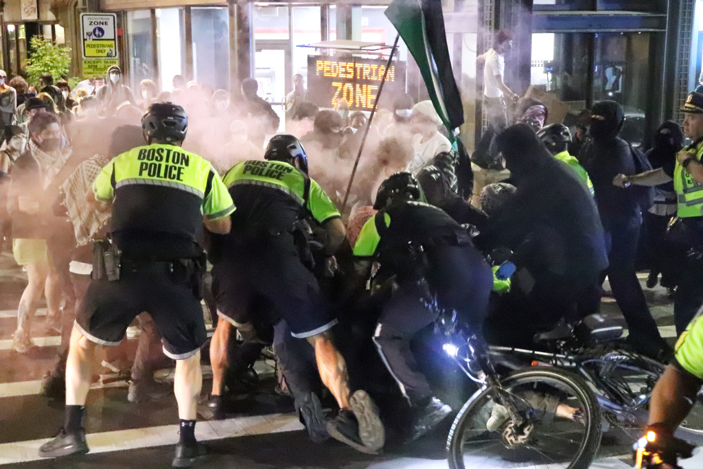 In this photo provided by Bryan Hecht, law enforcement detain a pro-Palestinian protester Tuesday, Oct. 7, 2025, in Boston. (Bryan Hecht/The Berkeley Beacon via AP)