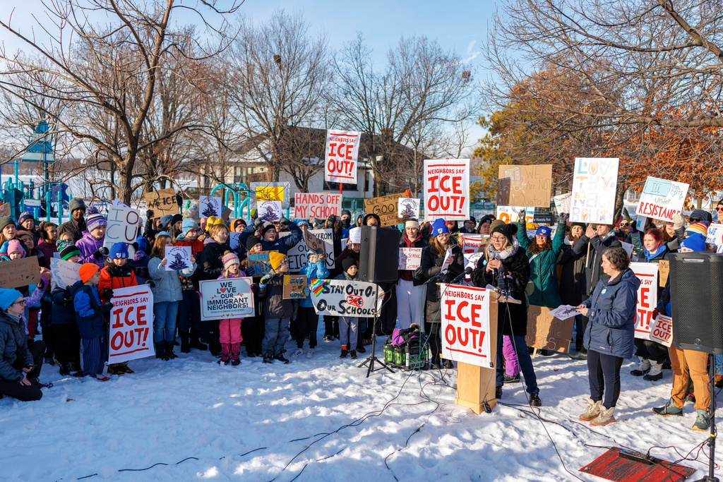 Minneapolis Public Schools families and educators hold a news conference at Lake Hiawatha Park in Minneapolis, on Friday, Jan. 9, 2026, demanding Immigration and Customs Enforcement be kept out of schools and Minnesota following the killing of 37-year-old mother Renee Good by federal agents earlier on Wednesday. (Kerem Yücel/Minnesota Public Radio via AP)