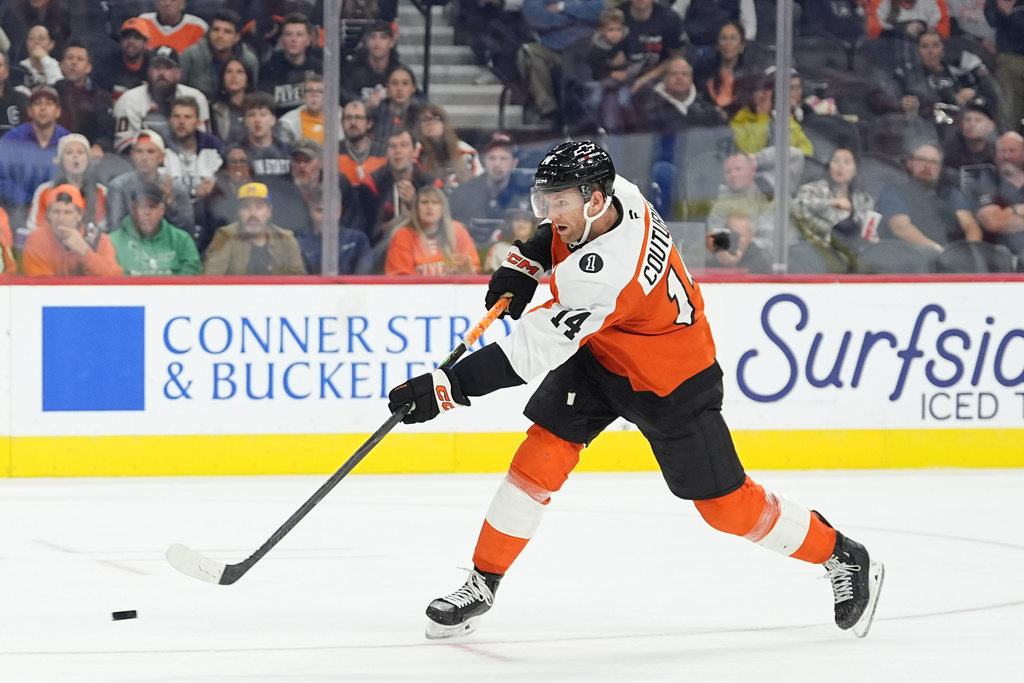 Philadelphia Flyers' Sean Couturier scores against Florida Panthers goaltender Daniil Tarasov during the second period of an NHL hockey game, Monday, Oct. 13, 2025, in Philadelphia. (AP Photo/Matt Rourke)
