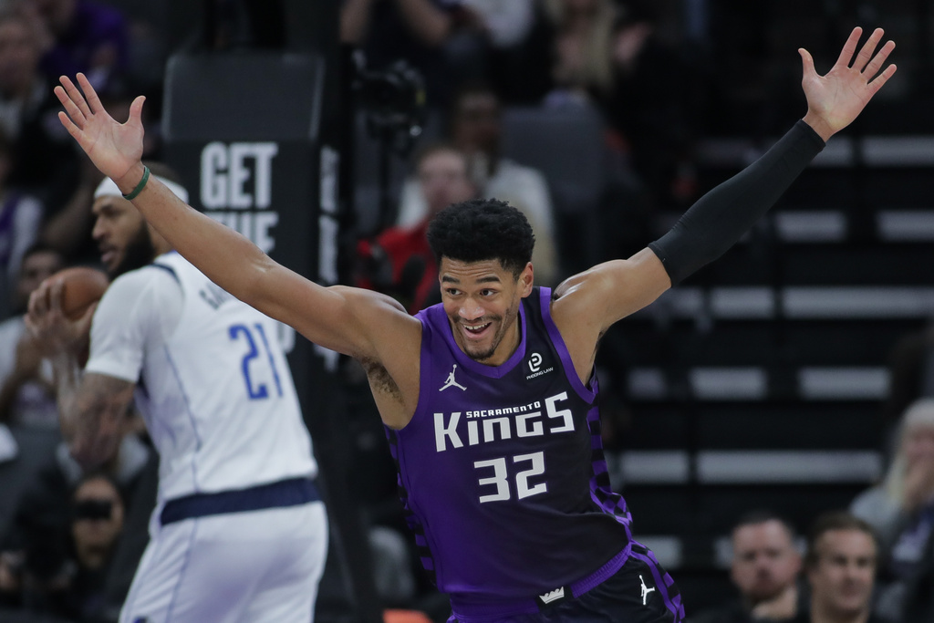 Sacramento Kings center Dylan Cardwell (32) reacts after dunking the ball against the Dallas Mavericks during the first half of an NBA basketball game Tuesday, Jan. 6, 2026, in Sacramento, Calif. (AP Photo/Scott Marshall)
