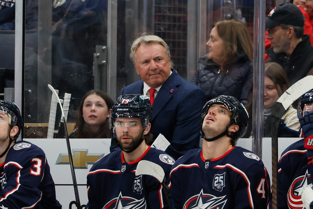 Columbus Blue Jackets head coach Rick Bowness watches his team play against the Calgary Flames during the first period of an NHL hockey game, Tuesday, Jan. 13, 2026, in Columbus, Ohio. (AP Photo/Jay LaPrete)
