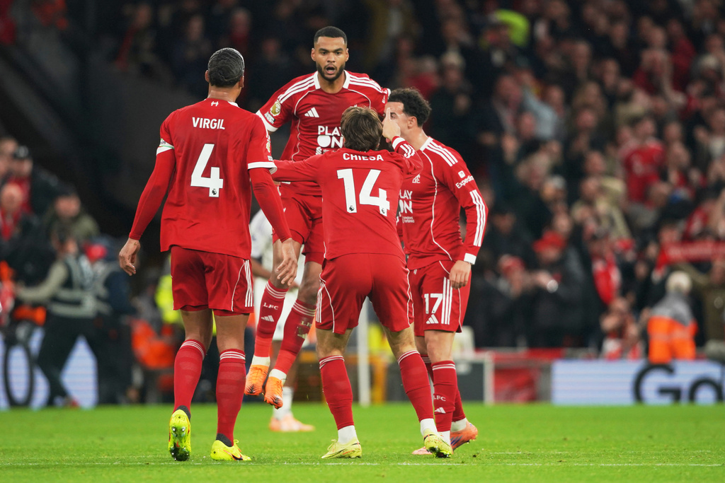 Liverpool players celebrate after Liverpool's Cody Gakpo scored his side's opening goal during the English Premier League soccer match between Liverpool and Manchester United in Liverpool, England, Sunday, Oct. 19, 2025. (AP Photo/Ian Hodgson)