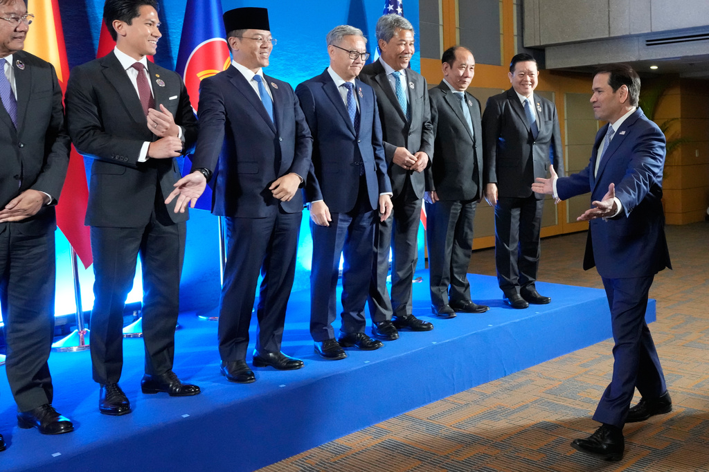 U.S. Secretary of State Marco Rubio, right, arrives for a group photo session during the ASEAN Post Ministerial Conference with the United States on the sidelines of the Association of Southeast Asian Nations (ASEAN) Foreign Ministers' Meeting in Pasay city, Metro Manila, Philippines Wednesday, July 22, 2026. (AP Photo/Aaron Favila, Pool)
