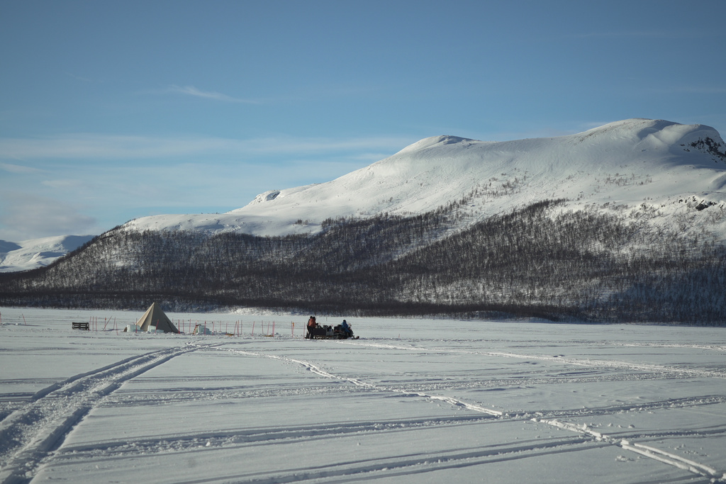 A snowmobile parked at Lake Kilpisjärvi during a Polar Scientific Diving class in Kilpisjärvi, Finland, March 15, 2026. (AP Photo/Kostya Manenkov)