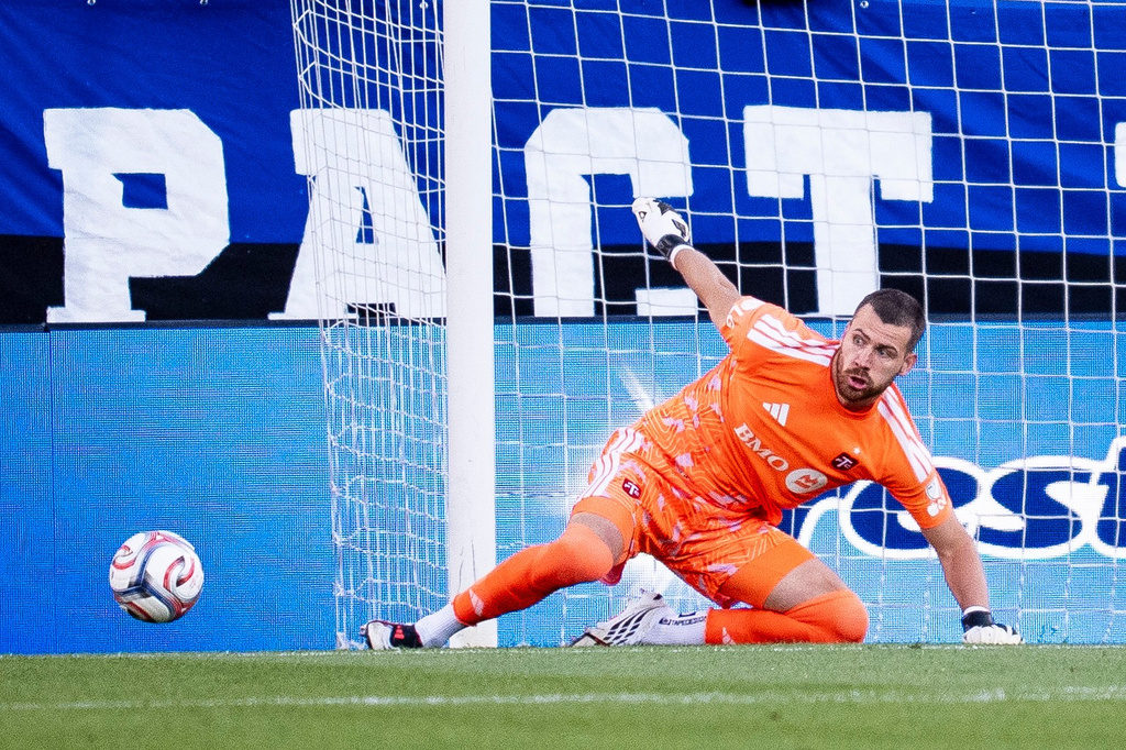 Toronto FC goalkeeper Luka Gavran (1) makes a save during first half MLS soccer game against CF Montreal, in Montreal on Thursday, July 16, 2026. (Christopher Katsarov/The Canadian Press via AP)