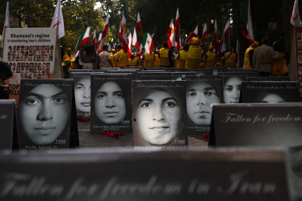 The faces of people activists say were killed by the government in Iran are displayed during a rally during the 80th session of the United Nations General Assembly, Tuesday, Sept. 23, 2025, in New York. (AP Photo/Heather Khalifa)