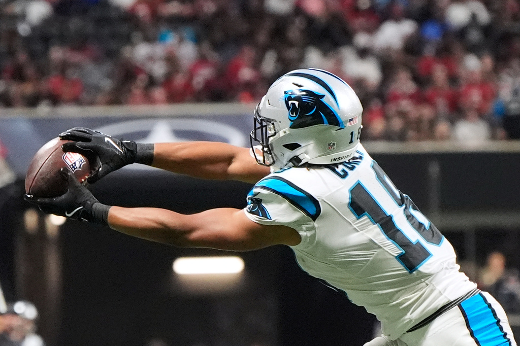 Carolina Panthers wide receiver Jalen Coker (18) makes a catch against Atlanta Falcons cornerback Mike Hughes (21) during an NFL football game in Atlanta, Sunday, Sept. 20, 2026. (AP Photo/Mike Stewart)
