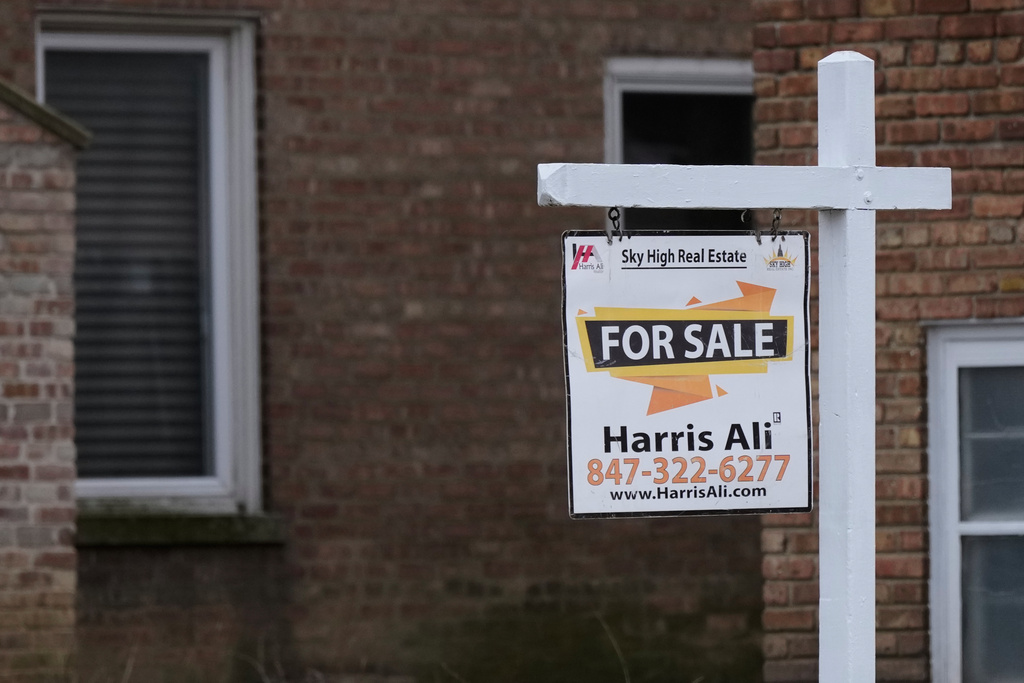 FILE - A "For Sale" sign is displayed in front of a home in Morton Grove, Ill., Tuesday, Jan. 6, 2026. (AP Photo/Nam Y. Huh)