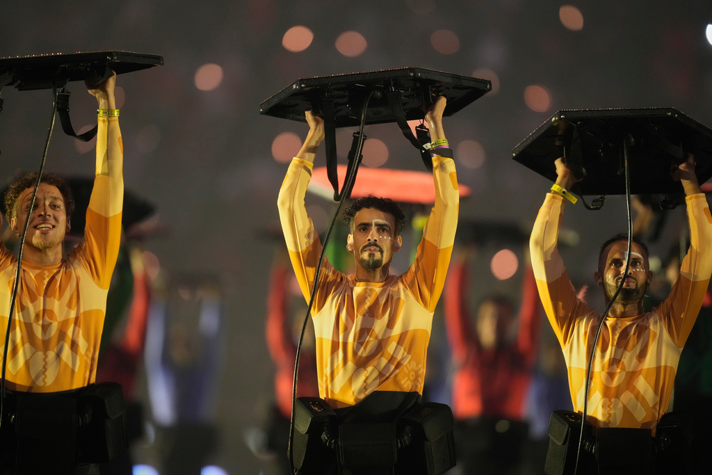 Performers take part in the opening ceremony of the Africa Cup of Nations and the opening group A soccer match between Morocco and Comoros in Rabat, Morocco, Sunday, Dec. 21, 2025. (AP Photo/Mosa'ab Elshamy)