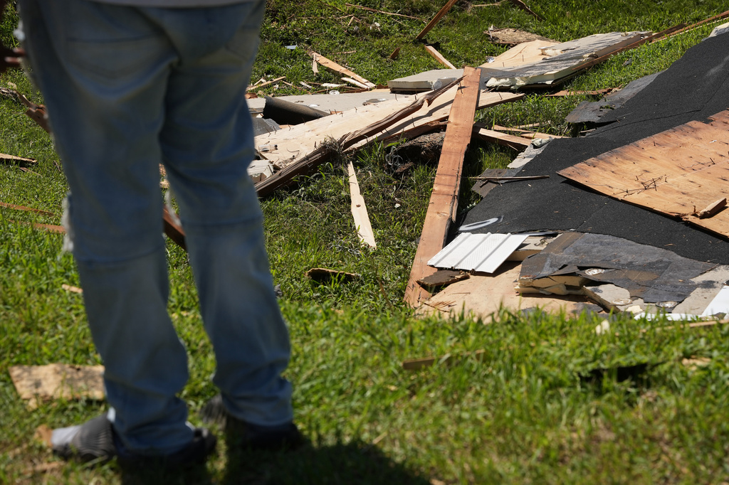 Wreckage from a tornado lies on the ground Friday, Aug. 21, 2026, in Dover, Del. (AP Photo/Mingson Lau)