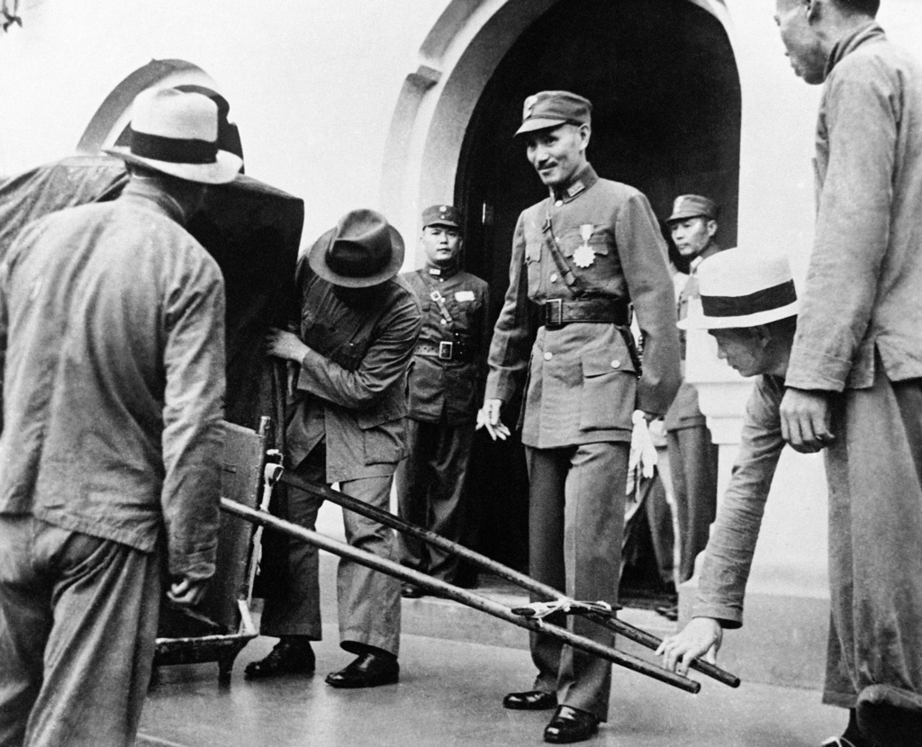 FILE - Generalissimo Chiang Kai-Shek, who has taken command of the Chinese military and air force defences against Japanese aggression, left for Kuling, on the Yangtse River between Hankow and Shanghai. Generalissimo Chiang Kai-Shek leaving his headquarters in Nanking to step into a rickshaw, on August 2, 1937. (AP Photo, File)
