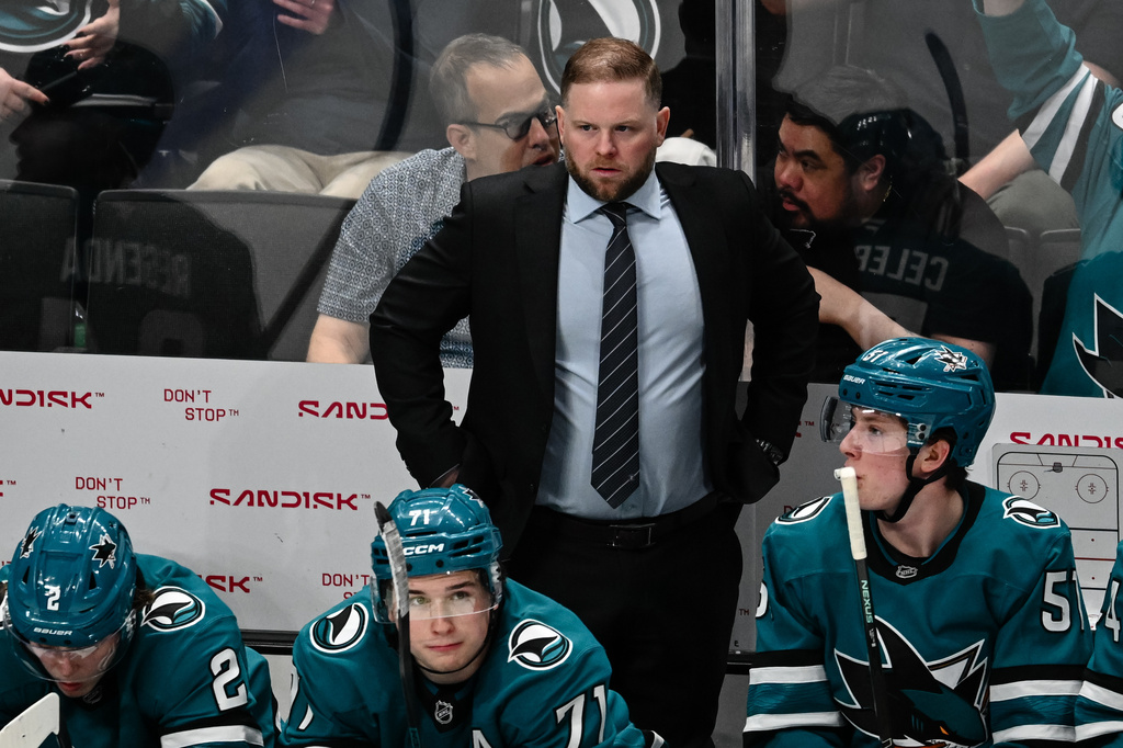 FILE - San Jose Sharks head coach Ryan Warsofsky looks on during the third period of an NHL hockey game against the Buffalo Sabres on March 19, 2026, in San Jose, Calif. (AP Photo/Thien-An Truong, File)