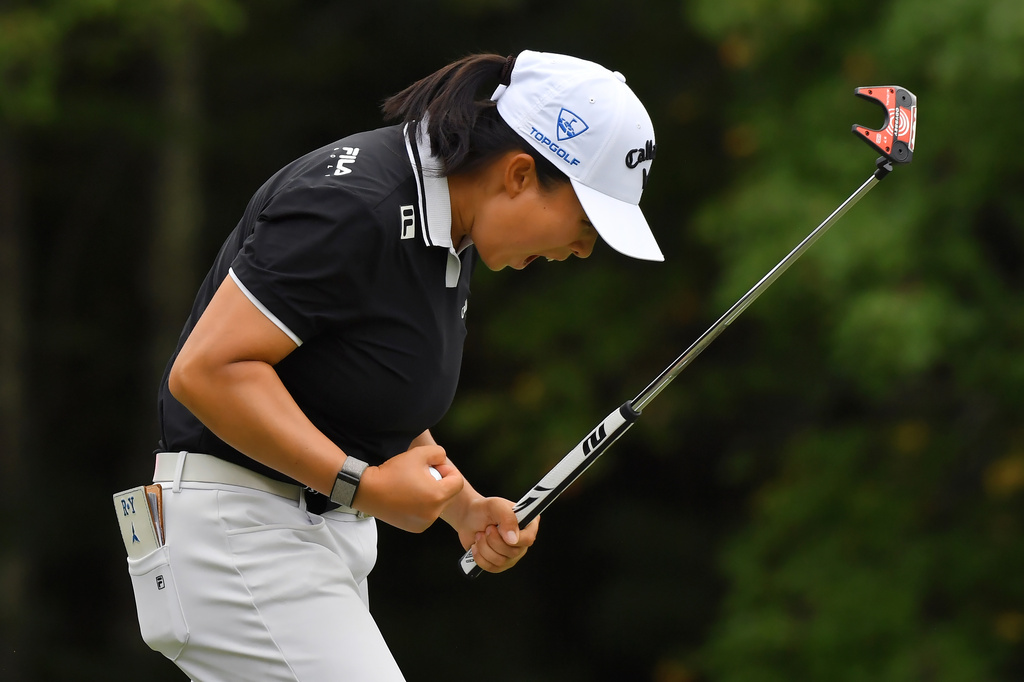 Ruoning Yin, of China, celebrates after sinking her final putt on the 18th green to win the LPGA FM Championship golf tournament, Sunday, Aug. 30, 2026, in Norton, Mass. (AP Photo/Steven Senne)