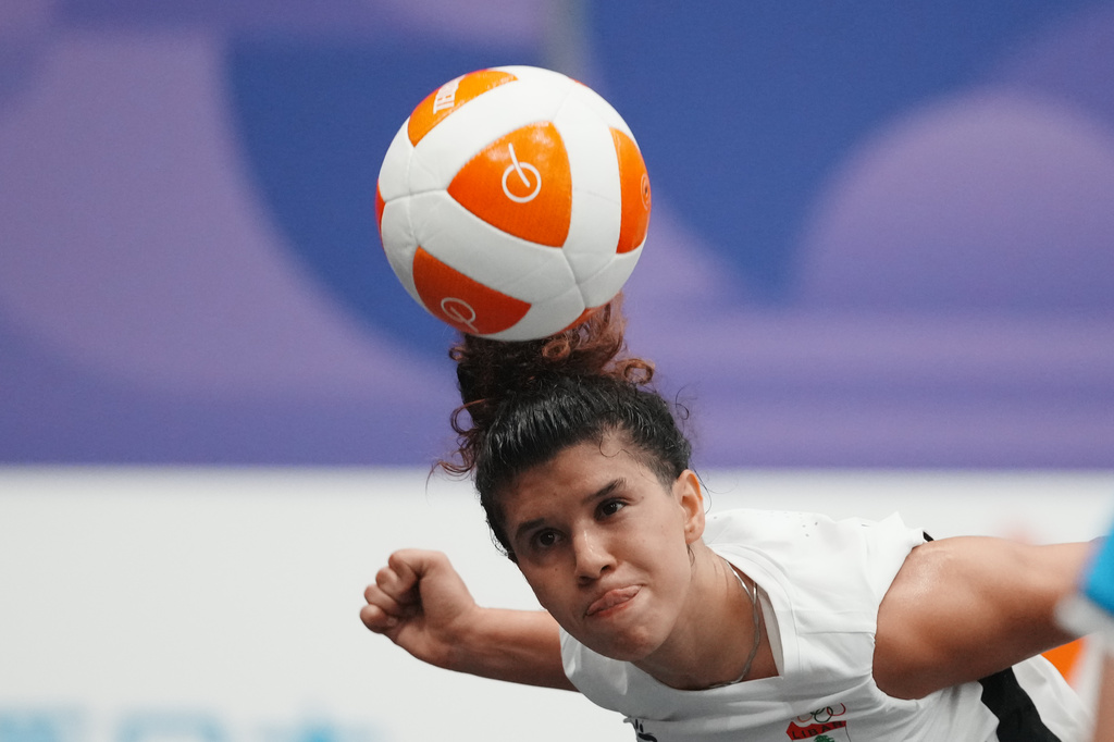 Lebanon's Kamar Dandal controls the ball during the women's singles bronze-medal teqball match against Cambodia's Koemyean Dy at the Asian Games in Nagoya, Japan, Sunday, Sept. 20, 2026. (AP Photo/Lee Jin-man)