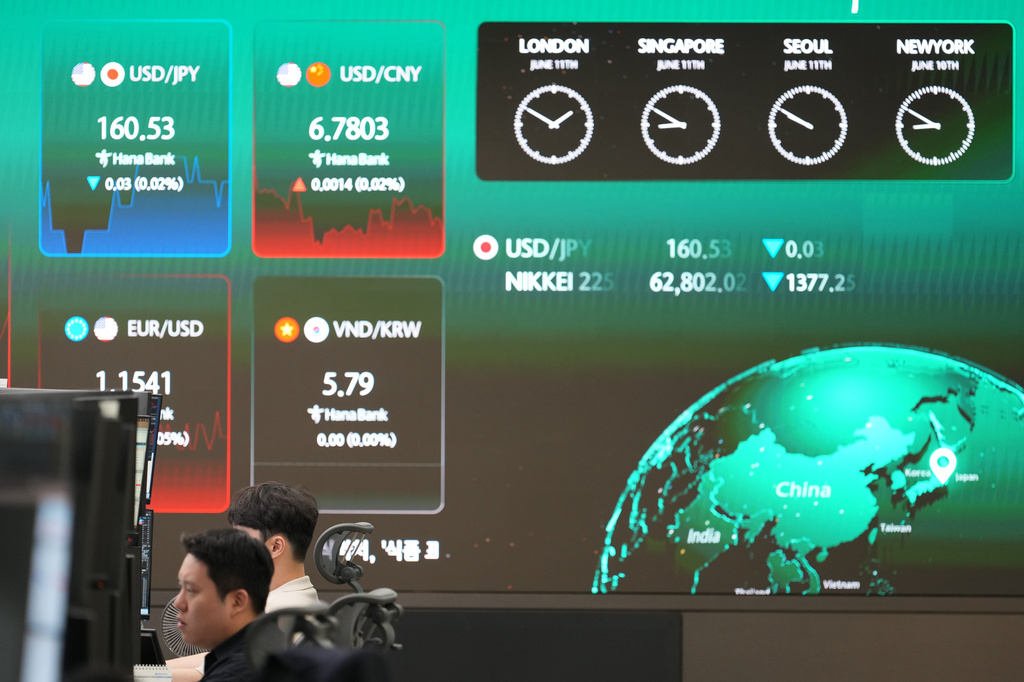 A screen shows foreign exchange rates at a dealing room of Hana Bank in Seoul, South Korea, Thursday, June 11, 2026. (AP Photo/Lee Jin-man)
