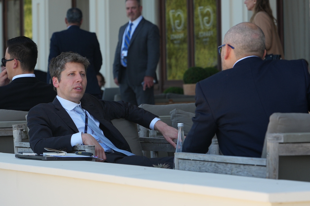 CEO of OpenAI Sam Altman, left, talks to CEO of Google DeepMind Demis Hassabis on the sidelines of the G7 summit, Wednesday, June 17, 2026, in Evian-les-Bains, France. (AP Photo/Julia Demaree Nikhinson)