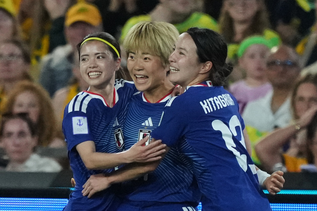 Japan's Maika Hamano, center, celebrates after scoring the first goal during the Women's Asian Cup soccer final between Japan and Australia in Sydney, Saturday, March 21, 2026. (AP Photo/Mark Baker)