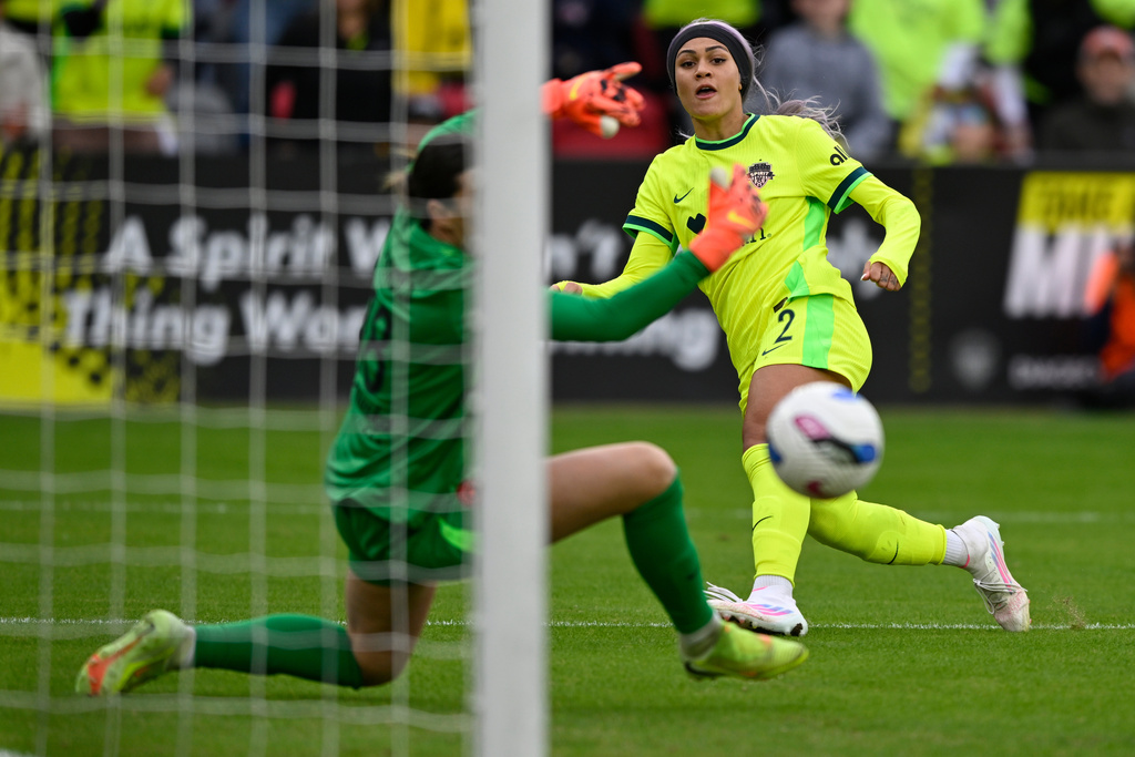 Washington Spirit forward Trinity Rodman (2) misses a shot at goal during the second half of a NWSL semifinal women's soccer match against Portland Thorns FC, Saturday, Nov. 15, 2025, in Washington. (AP Photo/John McDonnell)