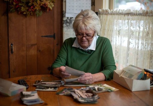 East Corinth resident Sarah Polli sifts through photographs she took during the filming of the first "Beetlejuice" film in East Corinth, Vt., Oct. 28, 2025. (AP Photo/Amanda Swinhart) East Corinth resident Sarah Polli sifts through photographs she took during the filming of the first "Beetlejuice" film in East Corinth, Vt., Oct. 28, 2025. (AP Photo/Amanda Swinhart)