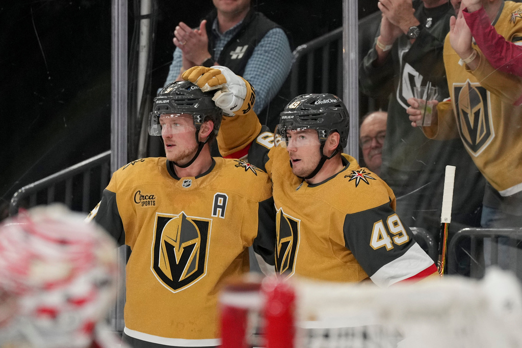 Vegas Golden Knights left wing Ivan Barbashev (49) and center Jack Eichel (9) celebrate Barbashev's goal against the Detroit Red Wings int he second period of an NHL hockey game Tuesday, Nov. 4, 2025, in Las Vegas. (AP Photo/Candice Ward)