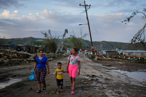 Residents walk in the aftermath of Hurricane Melissa in El Cobre, Cuba, Wednesday, Oct. 29, 2025. (AP Photo/Ramon Espinosa) Residents walk in the aftermath of Hurricane Melissa in El Cobre, Cuba, Wednesday, Oct. 29, 2025. (AP Photo/Ramon Espinosa)