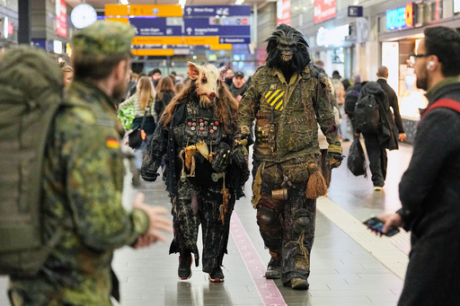 People dressed in scary costumes arrive at a train station to take part in a Halloween Zombie protest walk at the city center of Essen, Germany, Friday, Oct. 31, 2025. (AP Photo/Martin Meissner) People dressed in scary costumes arrive at a train station to take part in a Halloween Zombie protest walk at the city center of Essen, Germany, Friday, Oct. 31, 2025. (AP Photo/Martin Meissner)