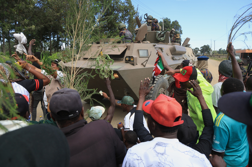Kenyan soldiers on a tank patrol as protesters demonstrate against a proposed Ebola quarantine center to be established by the United States at Laikipia Air Base in Nanyuki, Kenya, Monday, June 1, 2026. (AP Photo/Andrew Kasuku)