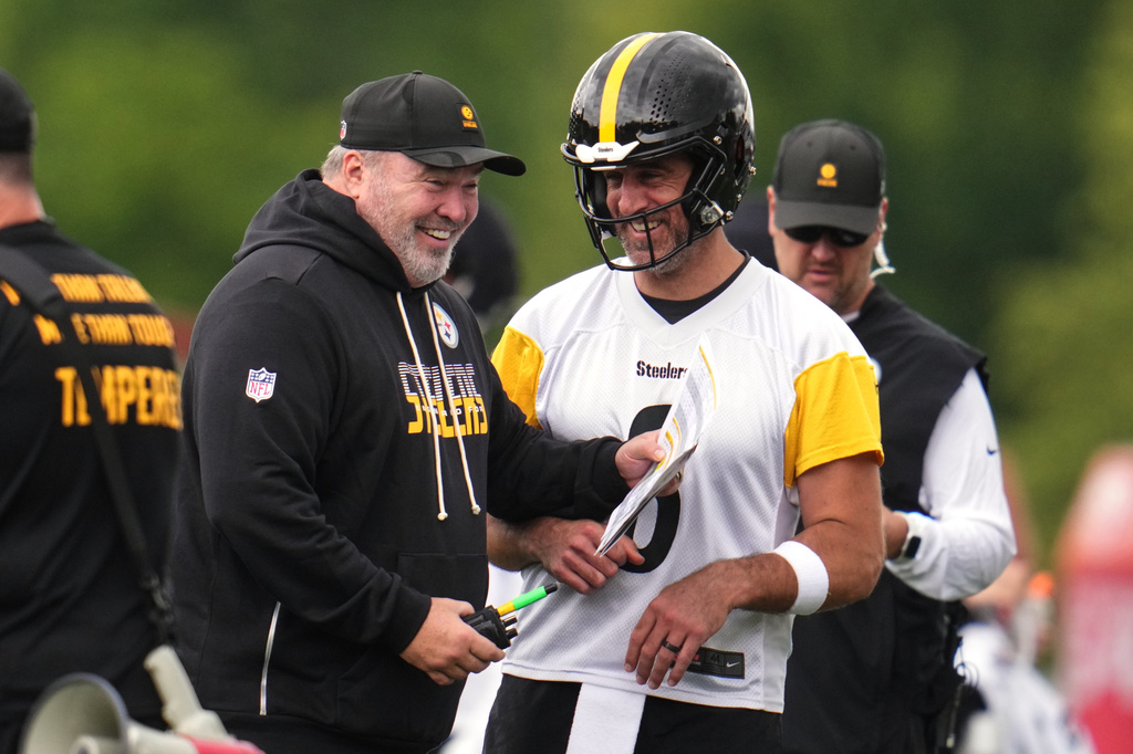 Pittsburgh Steelers quarterback Aaron Rodgers, right, shares a laugh with head coach Mike McCarthy during practice at the team's NFL football training camp in Latrobe, Pa., Wednesday, July 29, 2026. (AP Photo/Gene J. Puskar)