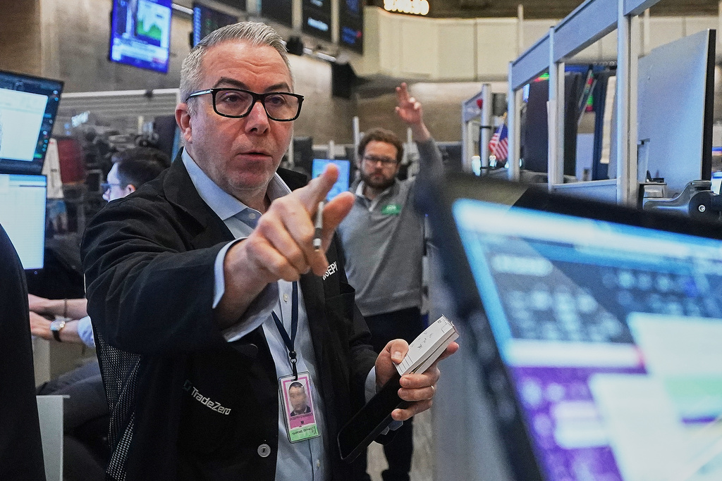 Options trader Joseph D'Arrigo works on the floor of the New York Stock Exchange, Wednesday, Jan. 7, 2026. (AP Photo/Richard Drew)