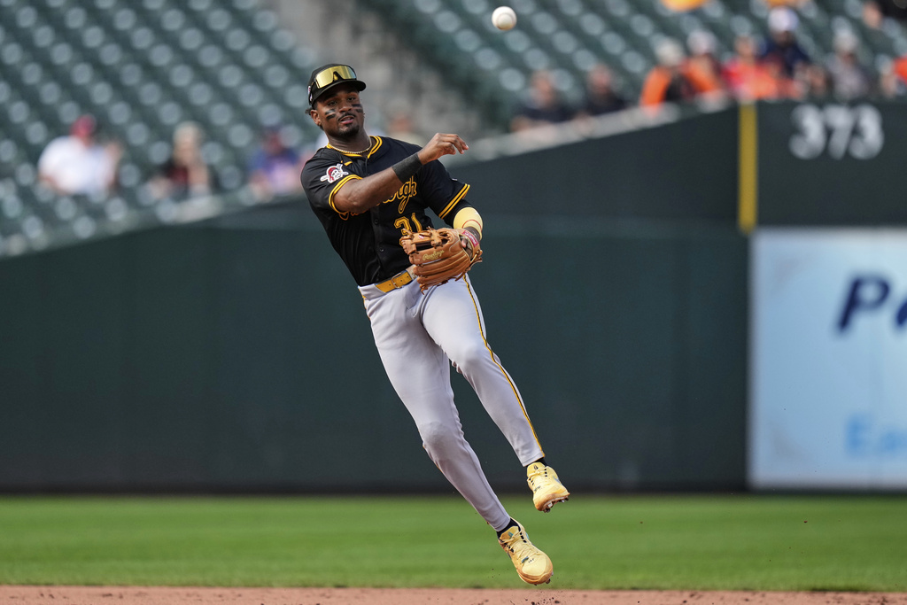 Pittsburgh Pirates shortstop Liover Peguero throws to first base to make an out against Baltimore Orioles' Coby Mayo during the eighth inning of a baseball game, Thursday, Sept. 11, 2025, in Baltimore. (AP Photo/Stephanie Scarbrough)