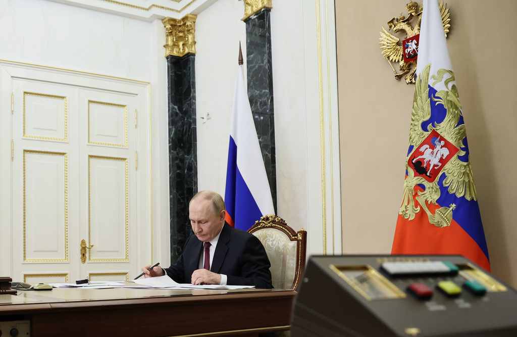 Russian President Vladimir Putin leads a cabinet meeting at the Kremlin in Moscow, Wednesday, Oct. 15, 2025. (Alexander Kazakov, Sputnik, Kremlin Pool Photo via AP)