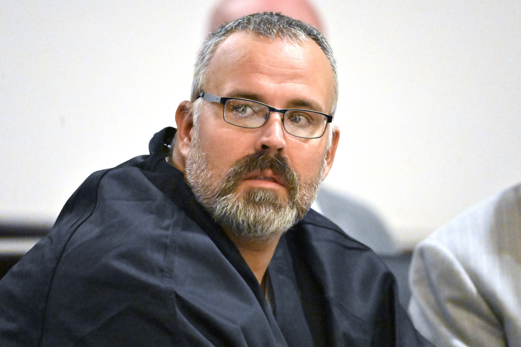 FILE - Former Letcher County Ky. Sheriff Shawn &quot;Mickey&quot; Stines looks over at the prosecutors during a hearing at the Morgan County Courthouse in West Liberty, Ky., Oct. 1, 2024. (AP Photo/Timothy D. Easley, File)