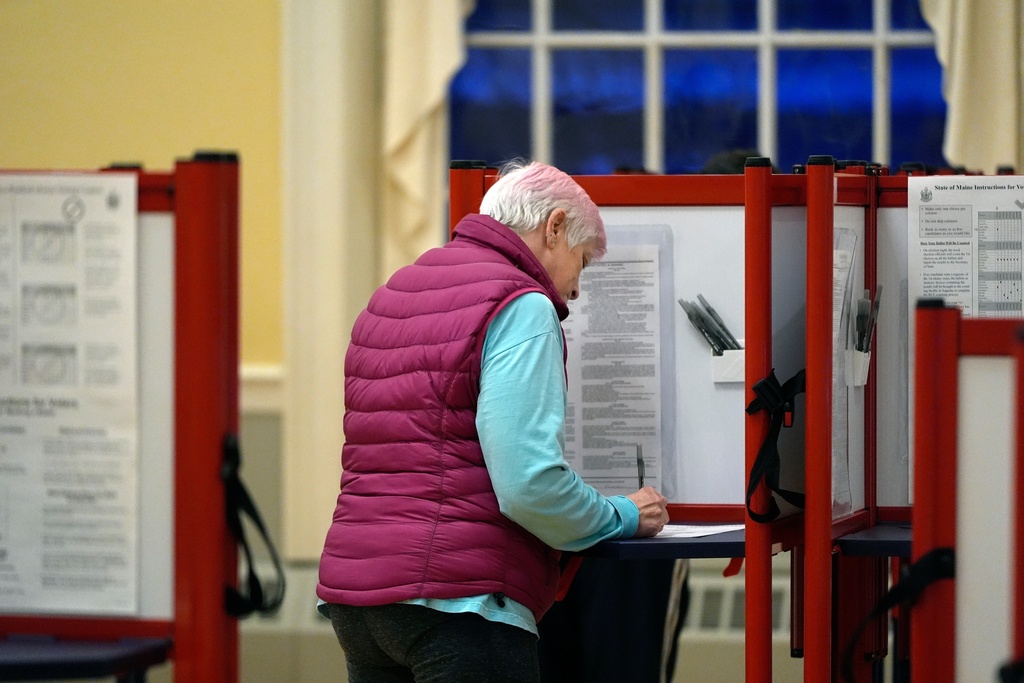 FILE - A voter marks a ballot at the polling station in Kennebunk, Maine, March 5, 2024. (AP Photo/Michael Dwyer, File)