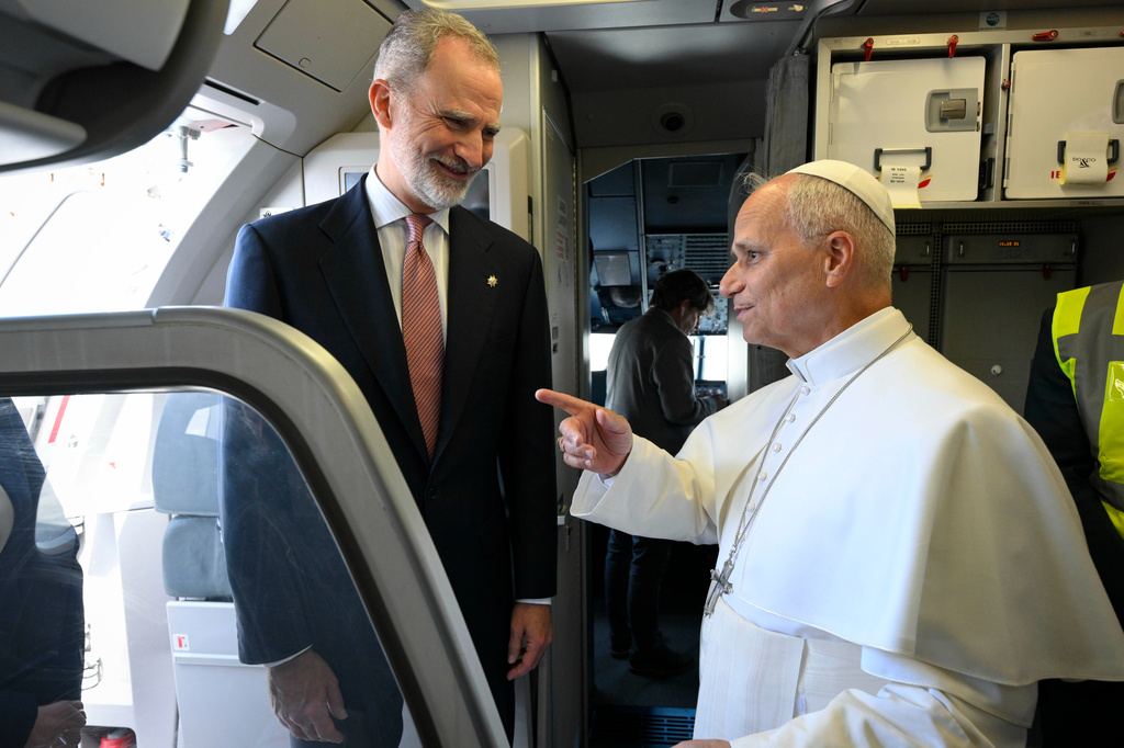 In this handout photo provided by Vatican Media, Pope Leo XIV speaks with King Felipe VI of Spain before deplaning after a technical problem at Tenerife Norte-Los Rodeos International Airport in Tenerife, Spain, Friday, June 12, 2026. (Vatican Media via AP)